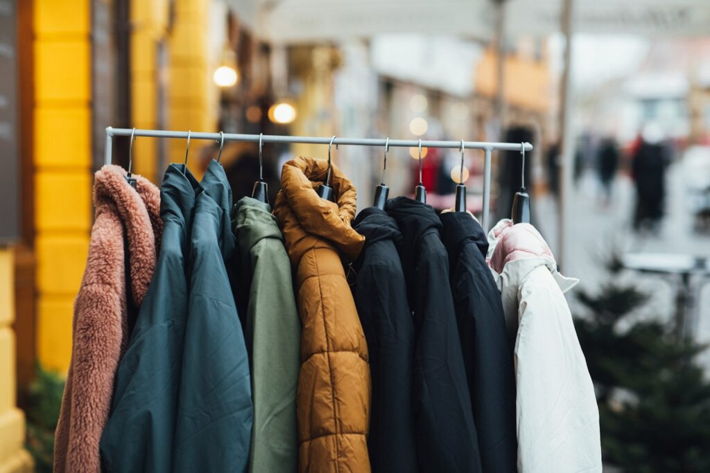 a rack of clothes hanging on a rail